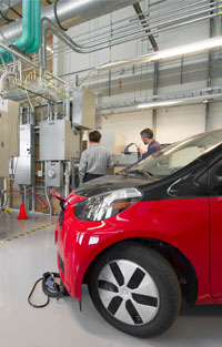 Photo of charging equipment plugged into an electric vehicle.