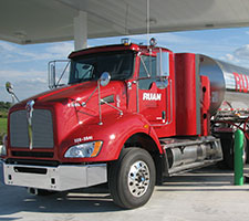 Photo of tractor-trailer sanitation vehicle at landfill.