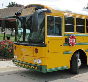 Photo of front end of yellow school bus.