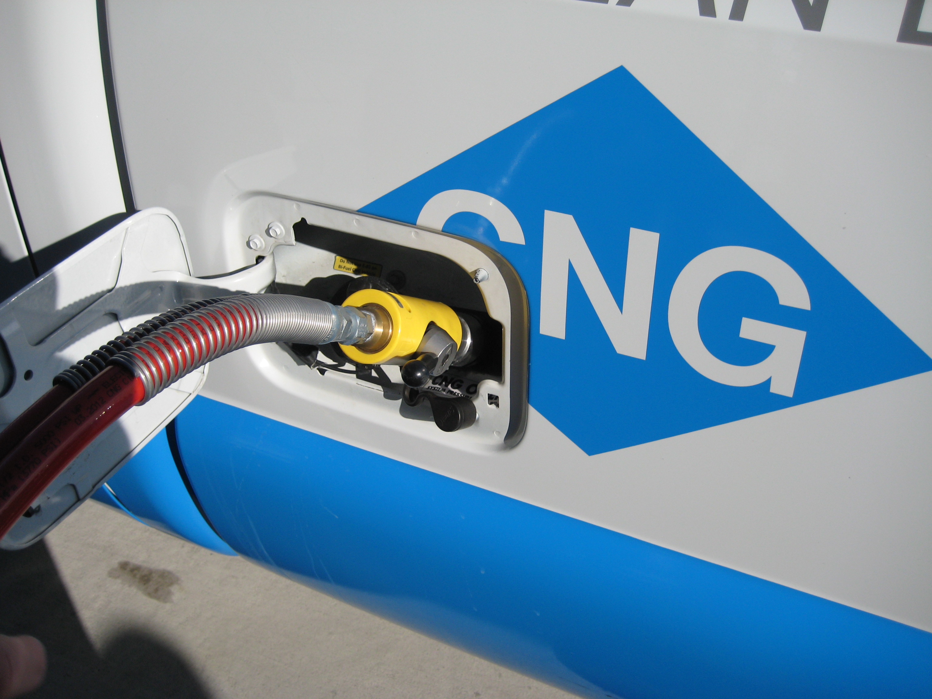 Compressed natural gas vehicle being fueled.