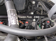 Photo of an engine converted to run on compressed natural gas.